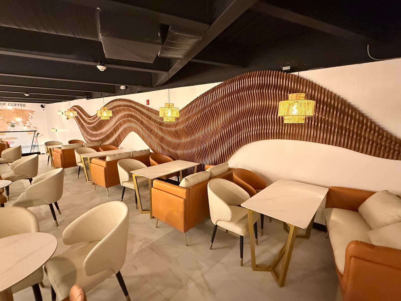 Parametric wave wall spanning 11 meters across a coffee shop interior, natural wood finish, BFW custom design commission