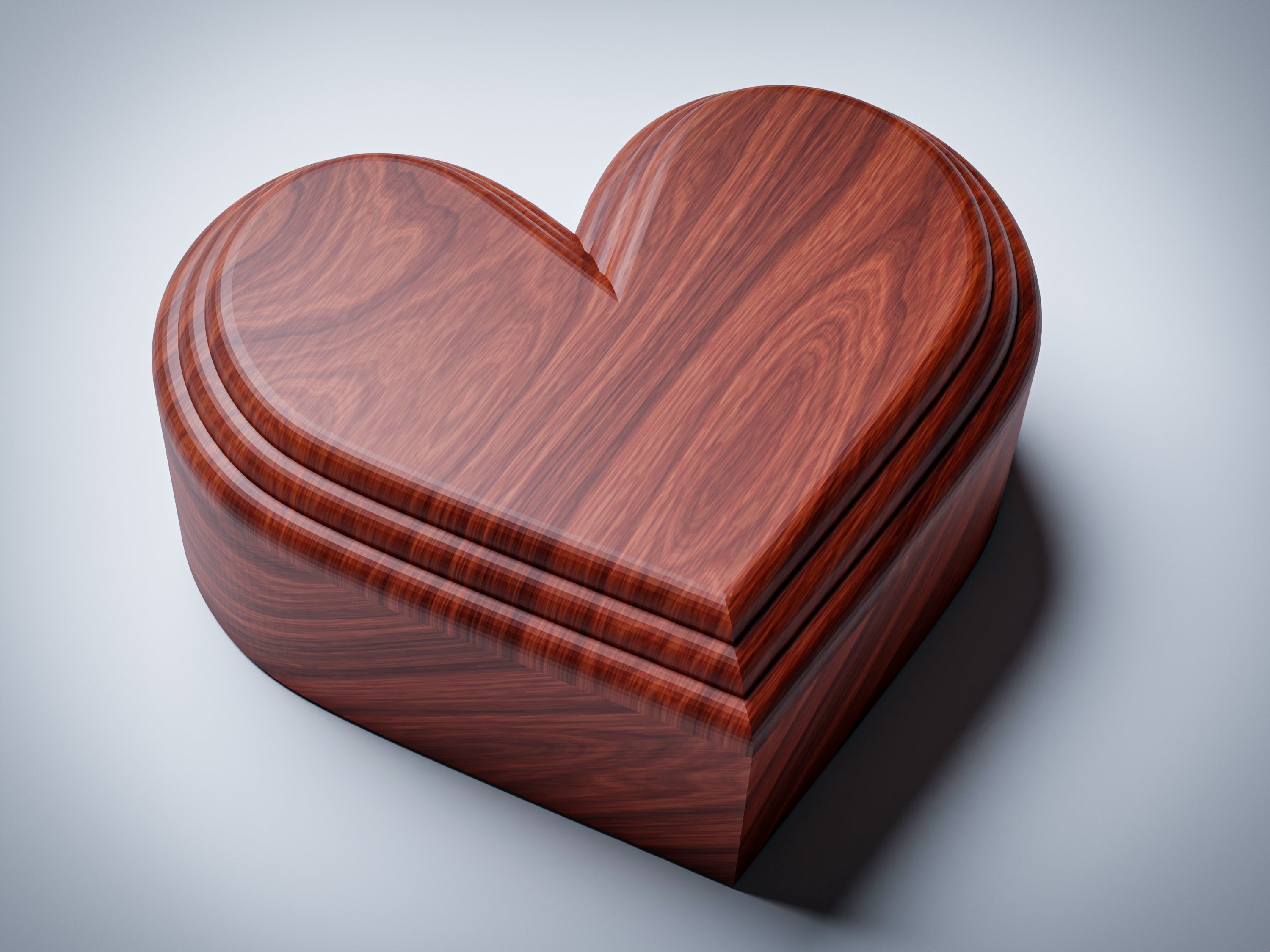 JB1 heart jewelry box CNC files, wood finish render, left-angle view showing concentric stepped lid profile and smooth box sides